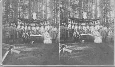 SA0157 - Men and women in a grove, the men on one side, the women on the other. Photo also shows a table with flowers., Winterthur Shaker Photograph and Post Card Collection 1851 to 1921c